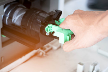 a man is repair his digital printer