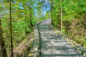 Scenic view of path near abandoned marble mine in Ruskeala national park in Karelia. Beautiful summer sunny look of road in popular touristic canyon on the North of Russian Federation