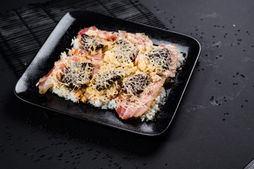 Sushi pizza on black