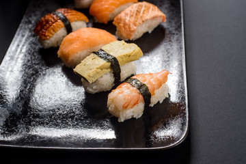 sashimi sushi set on black background