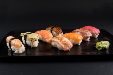 sashimi sushi set on black background