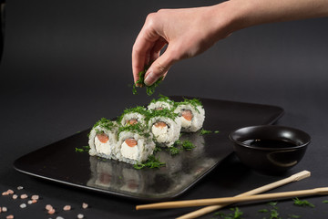 White japanese sushi on black background