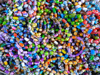 Many, colorful necklaces and bracelets. Close-up, full frame.