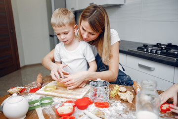 Family in a kitchen. Beautiful mother with little son
