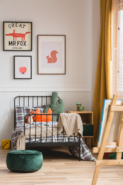 Vertical capture of genderless cozy bedroom in elegant tenement house