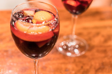 Glass of sangria with citrus fruits