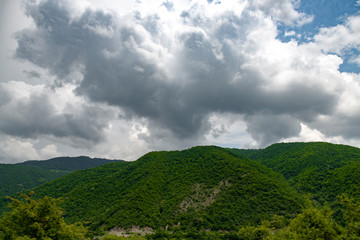 various mountain landscapes with cities and sky