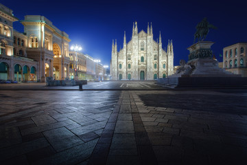 Fototapeta na wymiar Milan Piazza del Duomo square. City center illuminated at night. Milano, Italy