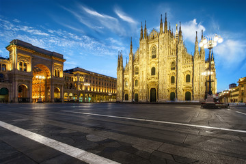 Fototapeta na wymiar Milan Piazza del Duomo square. City center illuminated in the dusk. Milano, Italy