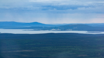 Rays of the setting sun over the mountain valley Khibiny