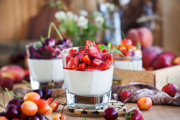 Delicious Italian dessert Panna Cotta with fresh summer berries and fruits