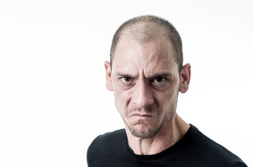Obraz premium Mad and aggressive guy in facial expressions and negative human emotions