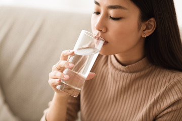 Healthy Liquid. Asian Girl Drinking Clean Water From Glass