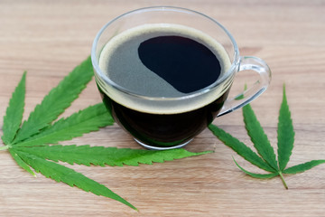 Black coffee with Cannabis(marijuana) leaves.
