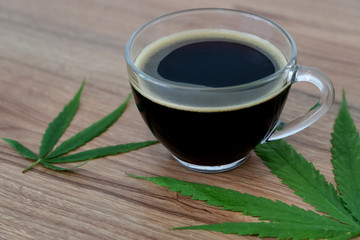Black coffee with Cannabis(marijuana) leaves.