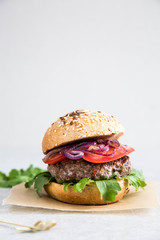 Craft homemade beef burger and french fries. Light background, copy space.
