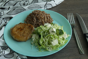 Medallion of pork stewed, buckwheat, cabbage salad, salted cheese and cucumbers