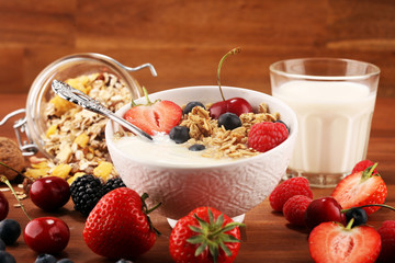 Cereal. Bowl of granola cereals, fruits and milk for breakfast. Muesli with cereals.
