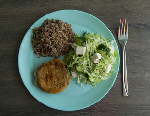 Medallion of pork stewed, buckwheat, cabbage salad, salted cheese and cucumbers