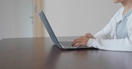 Woman work on laptop computer at home