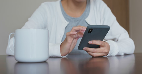 Woman use of cellphone at home