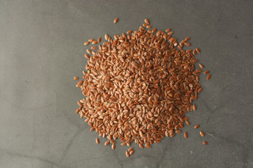 Linen. Flax seeds. Dark background. Healthy food concept.