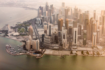 Unique aerial shot of the downtown waterfront of Doha, Qatar shot with tilt-shift lens.