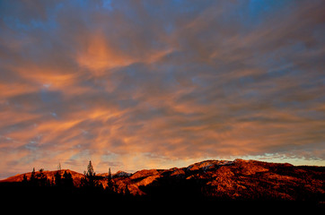 High orange clouds at sunset, Sierra Nevada Mountains, California 