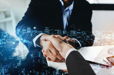Partnership. double exposure image of investor business man handshake with partner for successful...