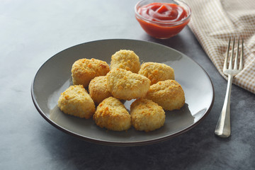 Chicken nuggets with ketchup. Fast food.