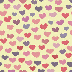 Fototapeta na wymiar A seamless vector valentine pattern with colorful hearts. Surface print design.