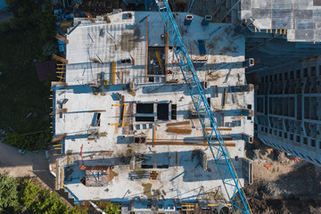 Aerial top view of construction site of new modern apartment residential building, drone photo