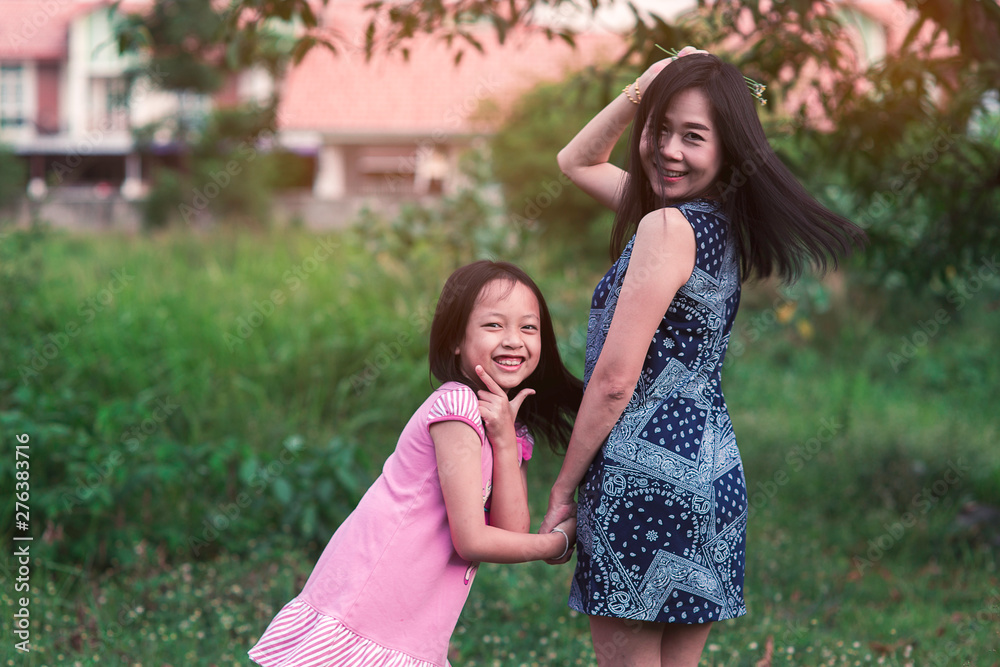 Wall mural mother and daughter holding hands with love