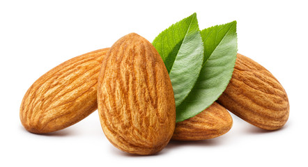 Close-up of almonds with leaves, isolated on white background