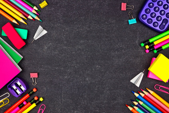 School supplies double side border. Overhead view on a chalkboard background with copy space. Back to school concept.