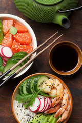 Poke bowl with salmon, shrimps and vegetables.