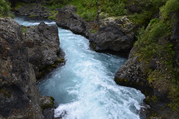 Blue water of a river near Barnafoss in Iceland