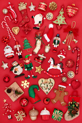 Christmas tree bauble decorations and ornaments on red background. Traditional theme with symbols...