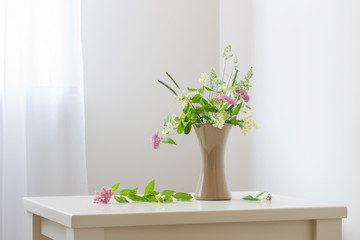 summer flowers in vase on table