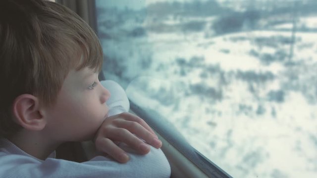 Travel by train over long distances in winter in the North.