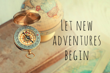 Let new adventures begin - inspiration quote on abstract blurred travel background. concept of...
