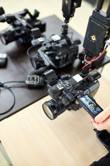 Behind the scenes of movie shooting or video production and film crew team with camera equipment at outdoor location.