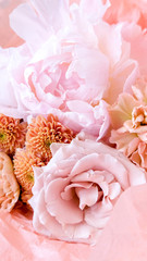 Flower shop with holiday beautiful flowers. Bouquet of flowers closeup background. 9:16. Vertical size of the picture.