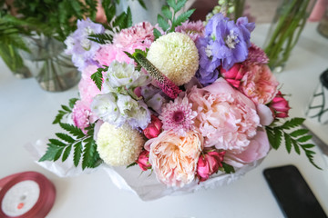 Flower shop with holiday beautiful flowers. Bouquet of flowers closeup background.