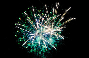 Colorful fireworks in the sky on black background. Celebratory salute, fireworks