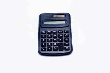 Black calculator placed isolated on a white background.Copy space.