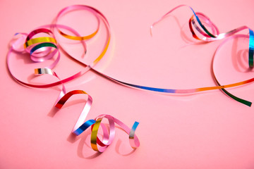 holiday colorful ribbons on pink background