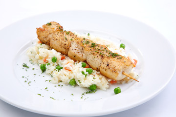 chicken kebab with rice and vegetables on the white background