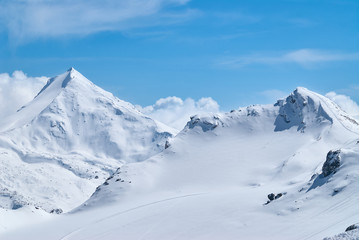 Winter mountains view with the high peaks covered by the snow near Saas-Fee in Switzerland.