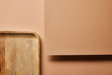 top view of wooden tray and plywood on brown